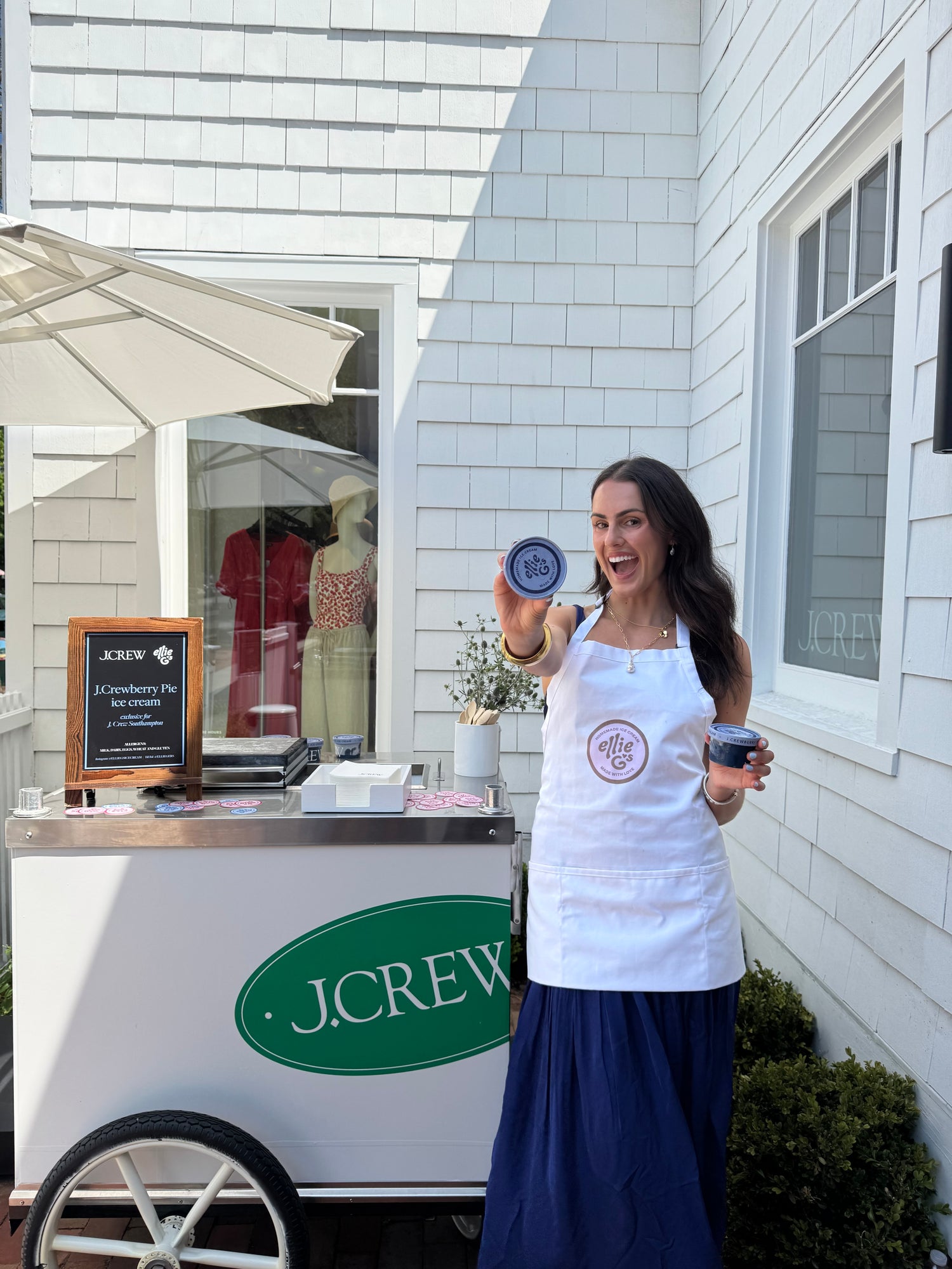 Ellie G holding a ice cream in front of a J.Crew store